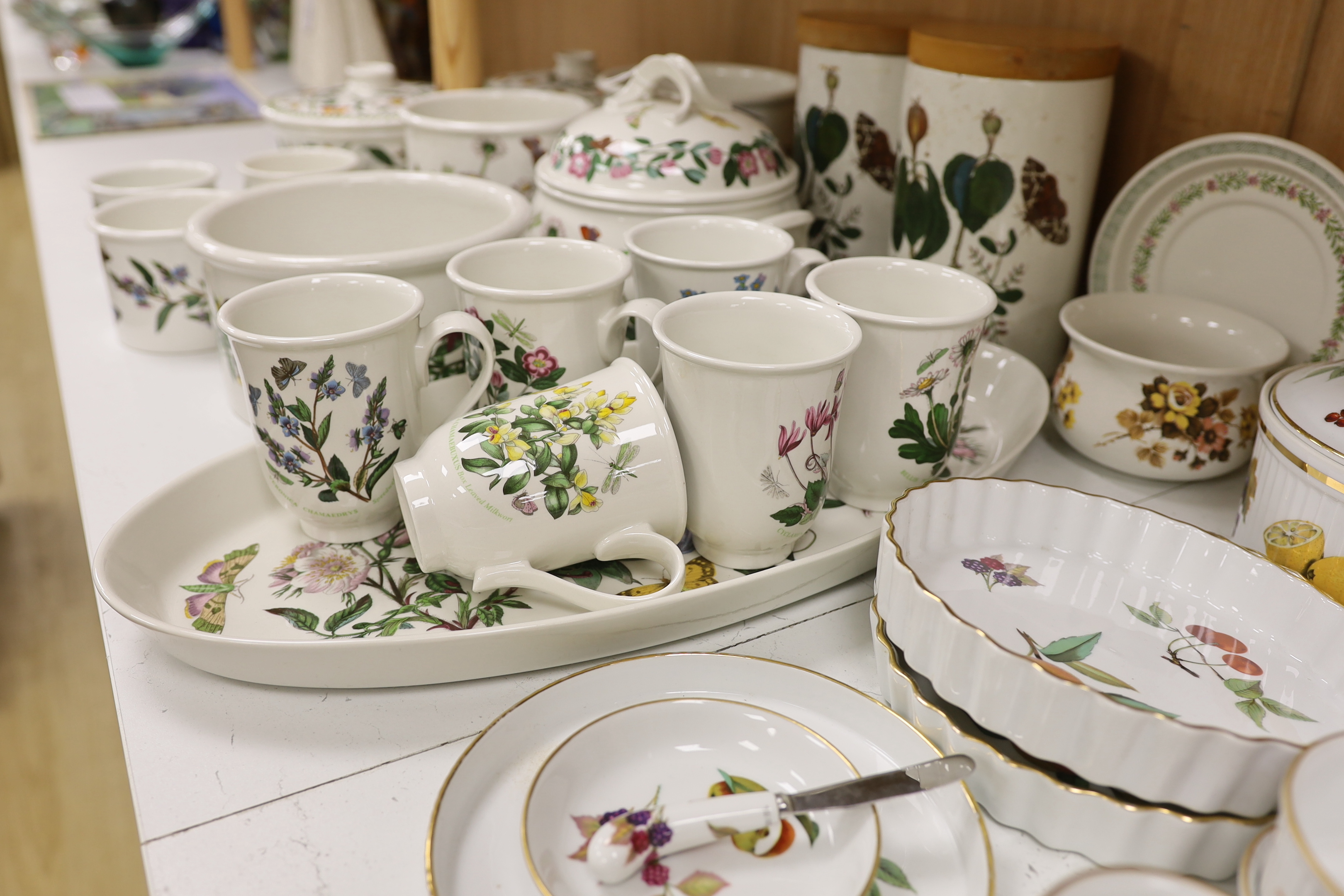 A Royal Worcester Evesham part dinner service, together with Portmeirion items including eight mugs, three lidded tureens, etc.